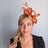 Burnt orange feather fascinator hat