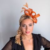 Burnt orange feather fascinator hat