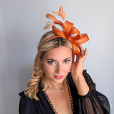 Burnt orange feather fascinator hat