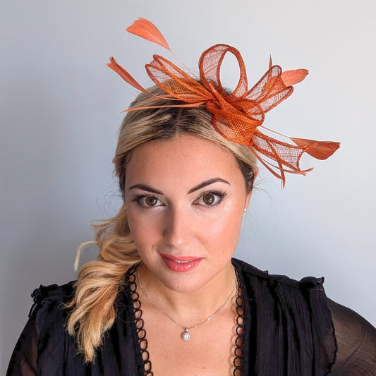 Burnt orange feather fascinator hat