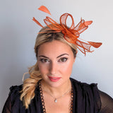 Burnt orange feather fascinator hat