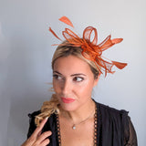 Burnt orange feather fascinator hat