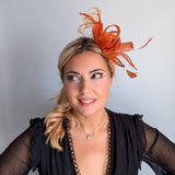 Burnt orange feather fascinator hat
