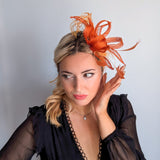 Burnt orange feather fascinator hat