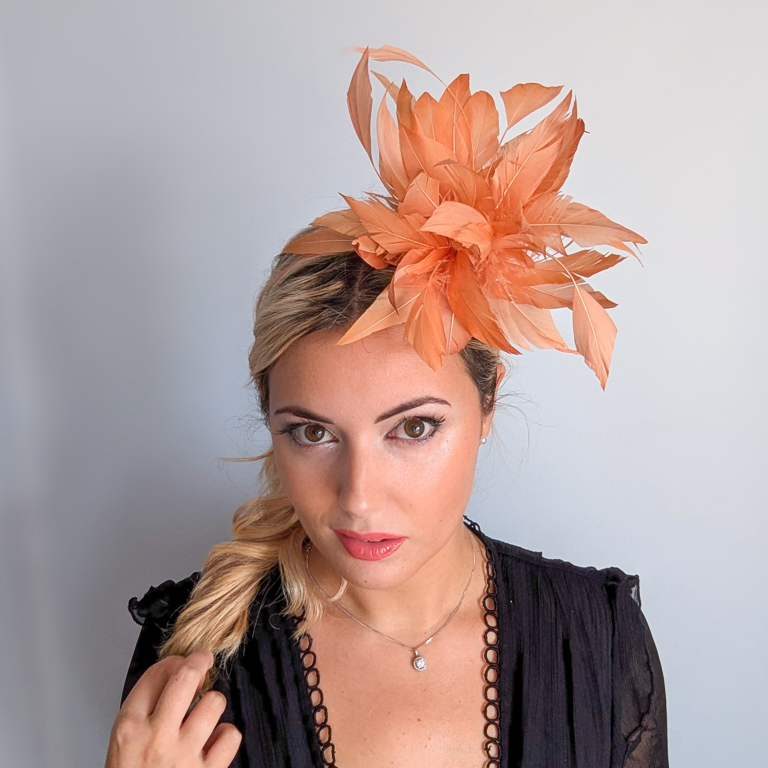 Light orange ombre feather fascinator hat