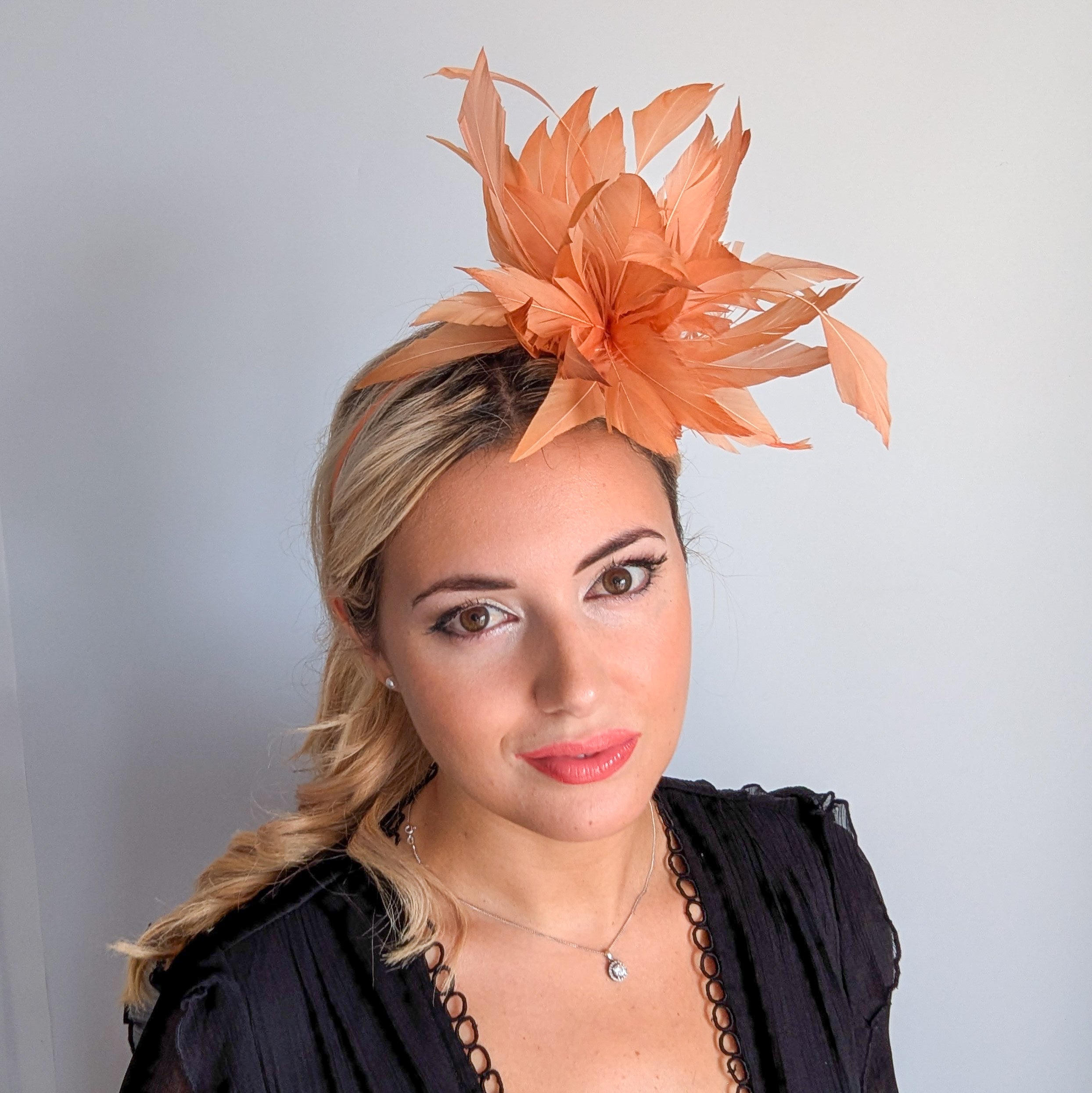 Light orange ombre feather fascinator hat