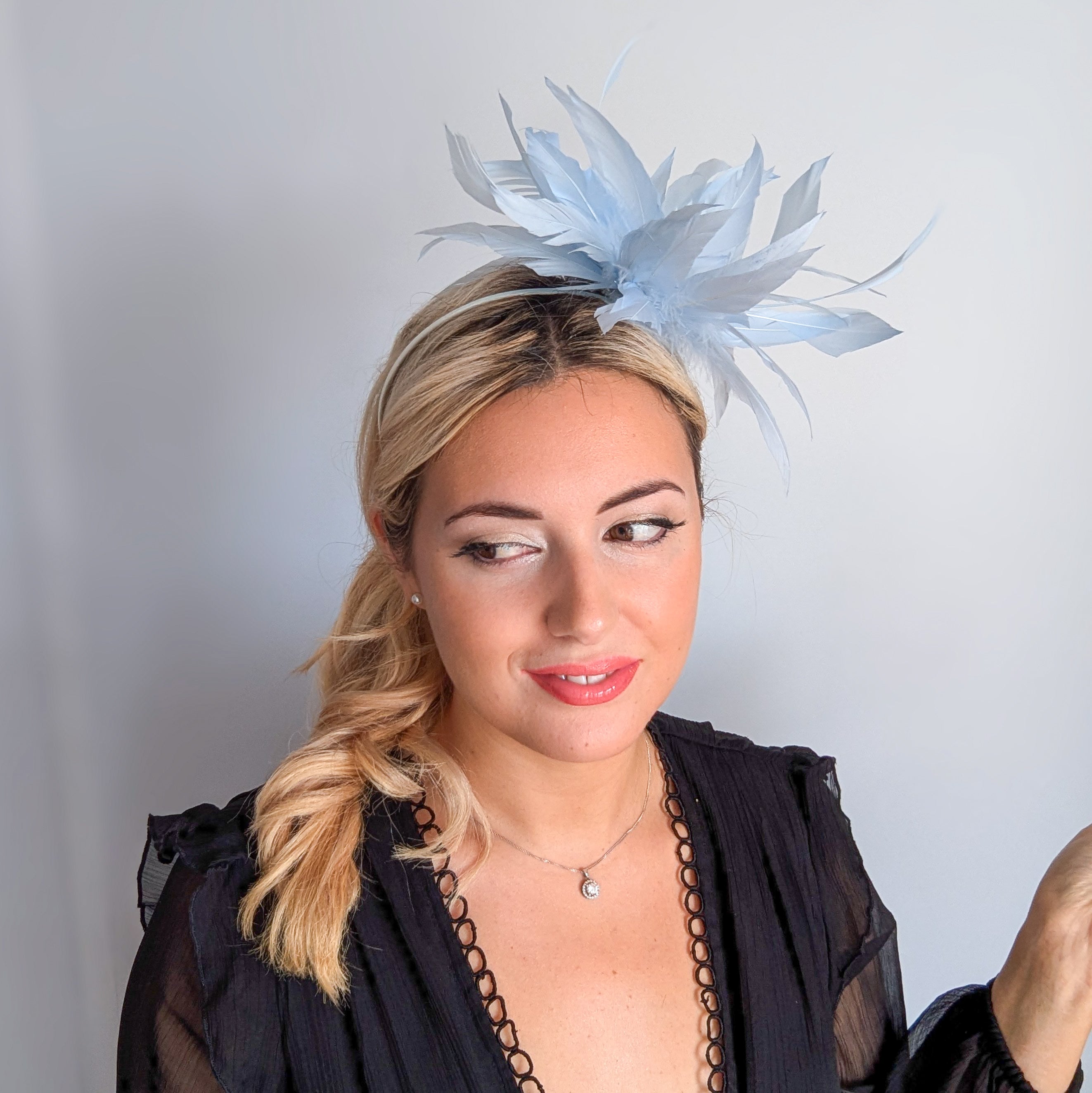 Light baby blue feather fascinator hat