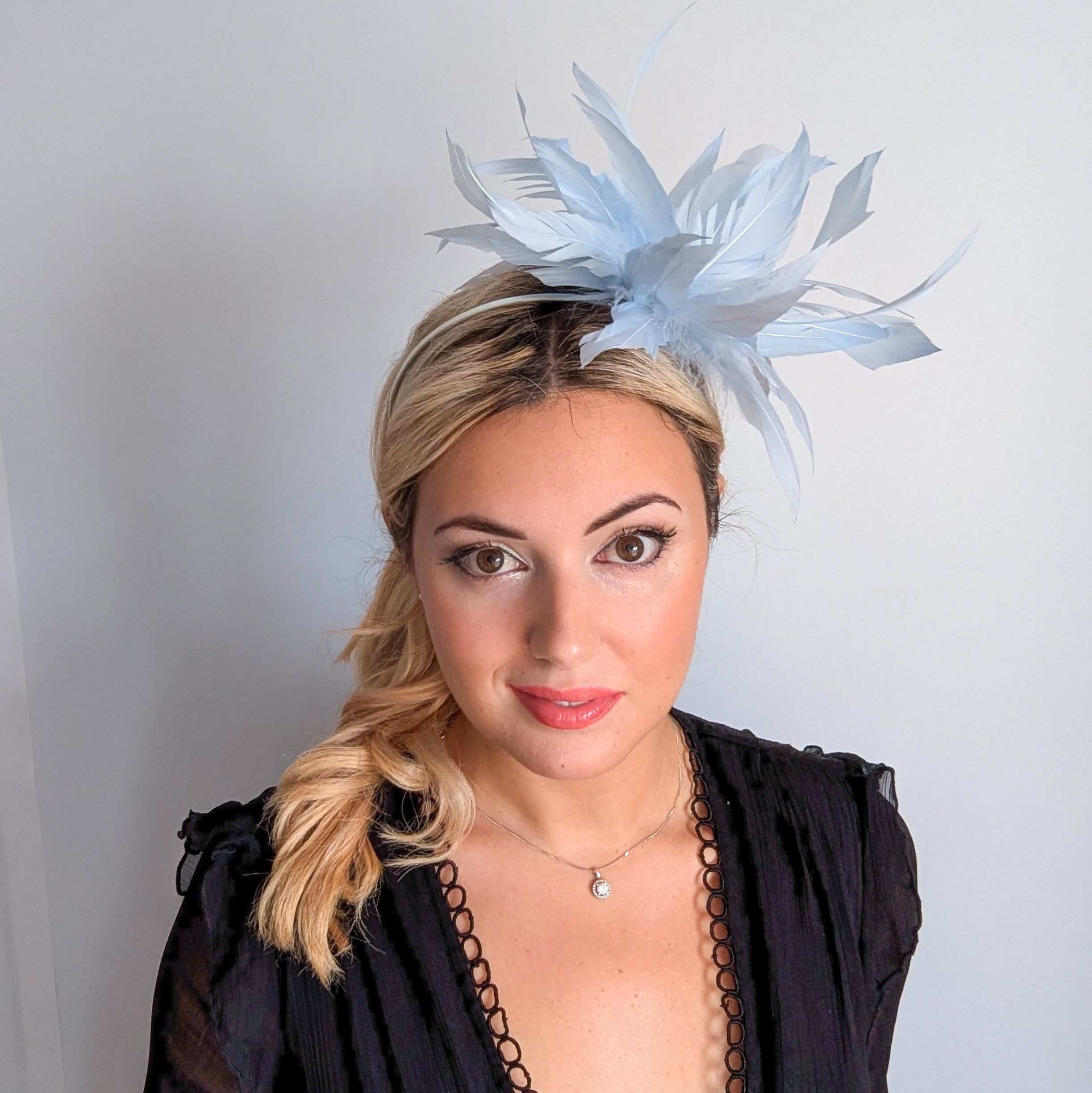 Light baby blue feather fascinator hat
