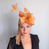 Tangerine orange feather disc fascinator hat