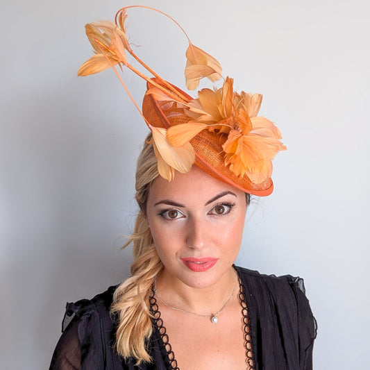 Tangerine orange feather disc fascinator hat