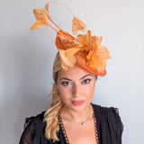 Tangerine orange feather disc fascinator hat