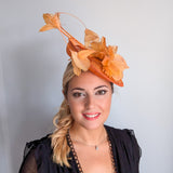 Tangerine orange feather disc fascinator hat