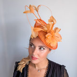 Tangerine orange feather disc fascinator hat