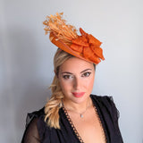 Tangerine orange feather disc fascinator hat