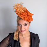 Tangerine orange feather disc fascinator hat