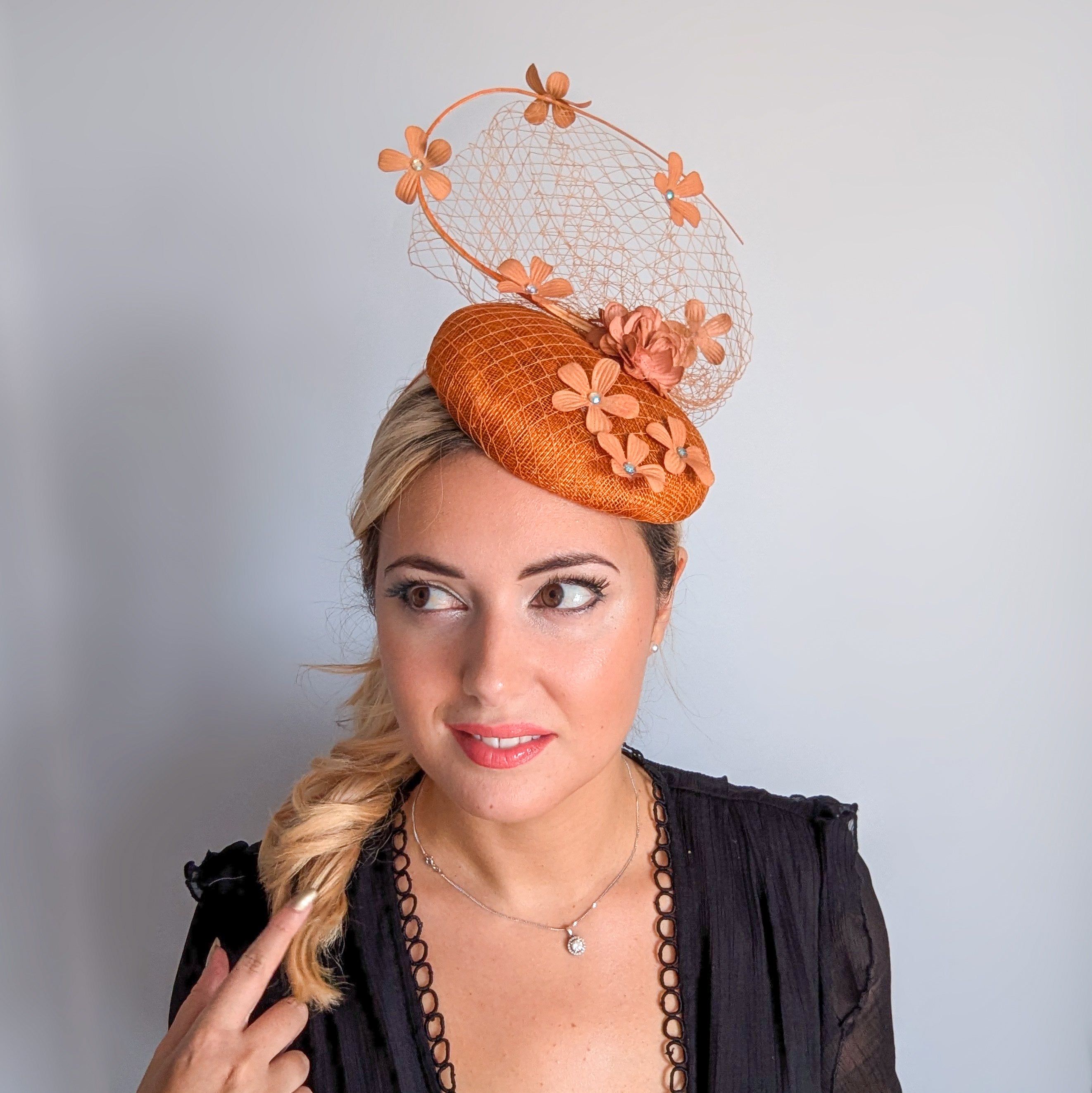 Burnt orange flower fascinator hat