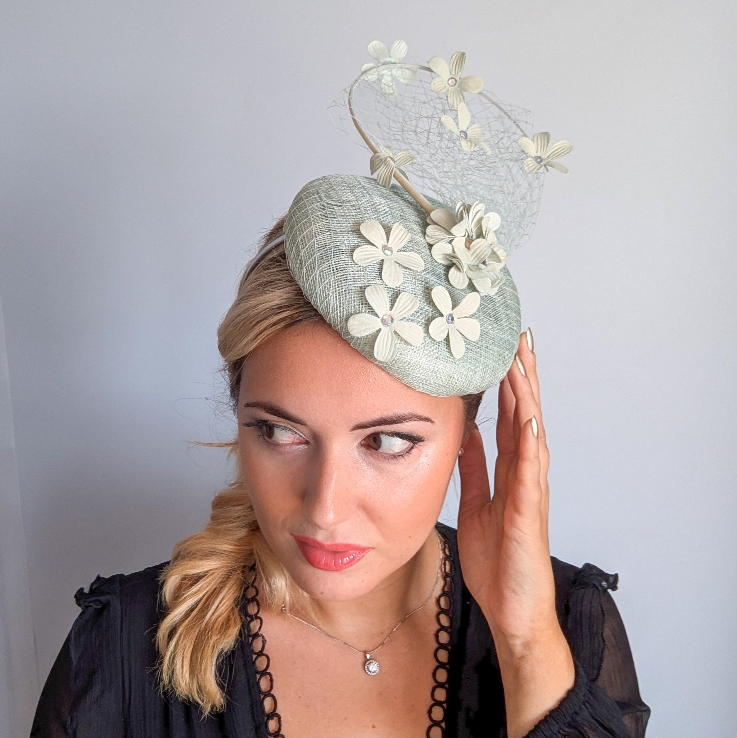 Light aquamarine blue flower fascinator hat