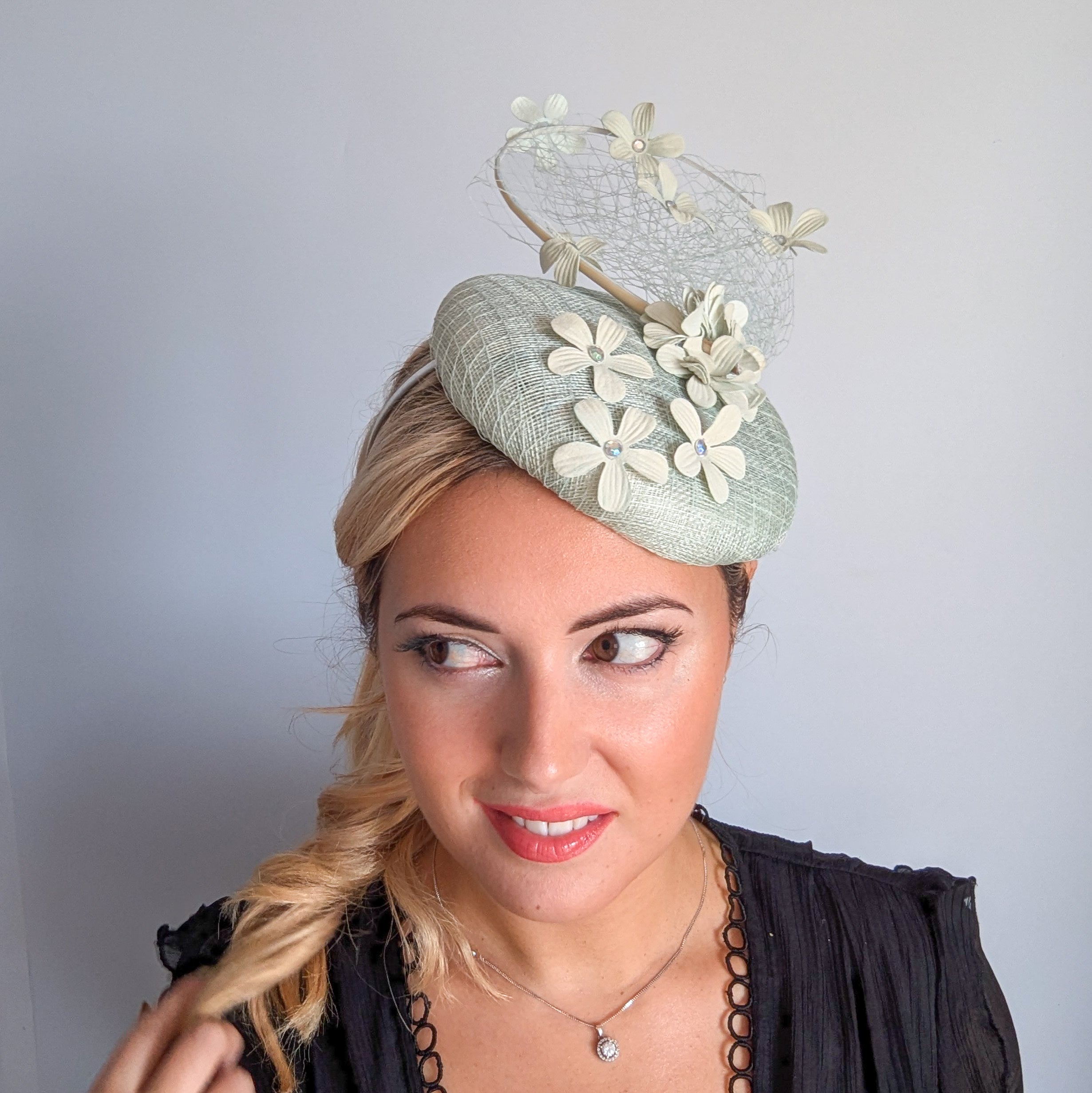 Light aquamarine blue flower fascinator hat
