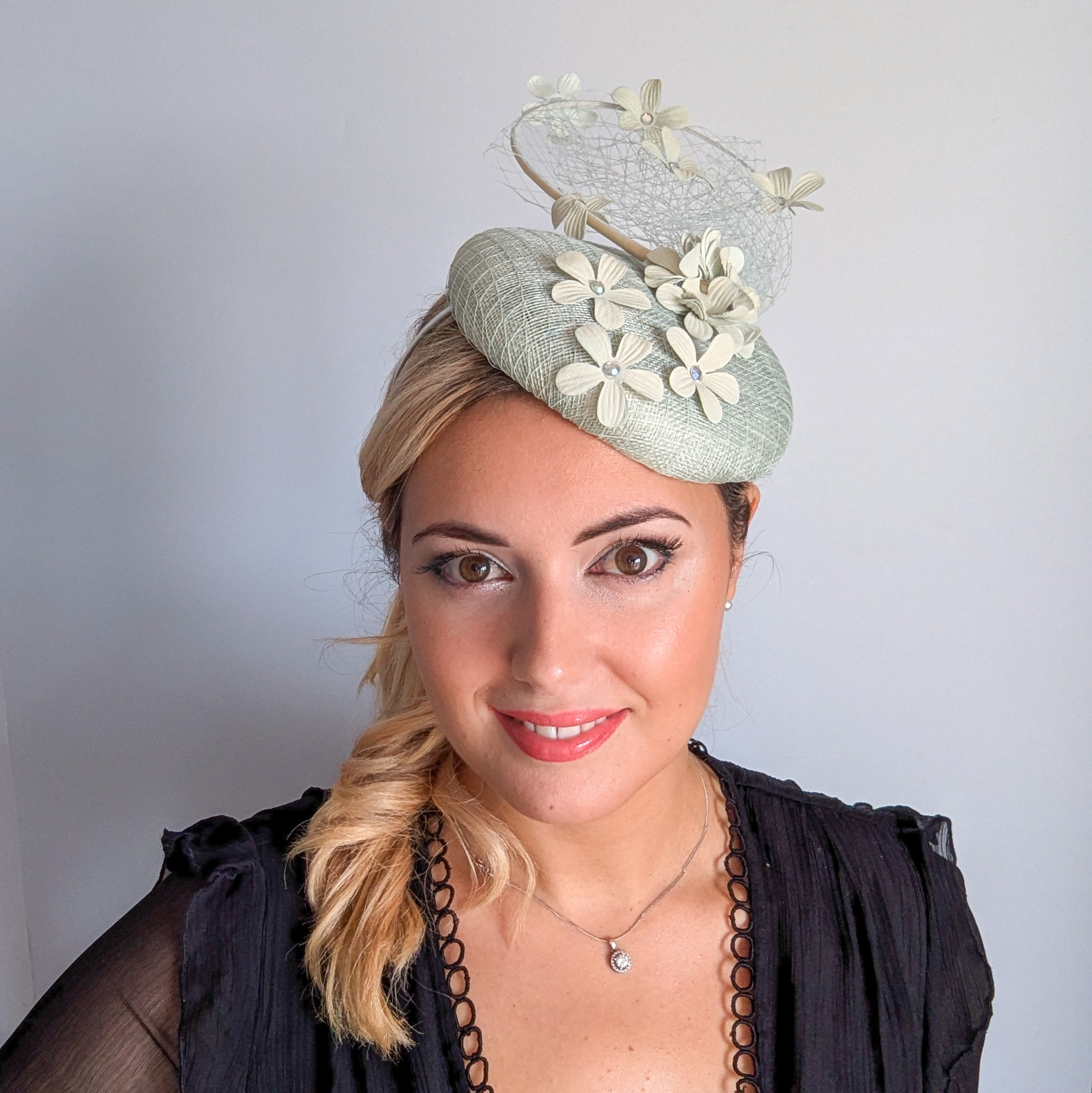 Light aquamarine blue flower fascinator hat