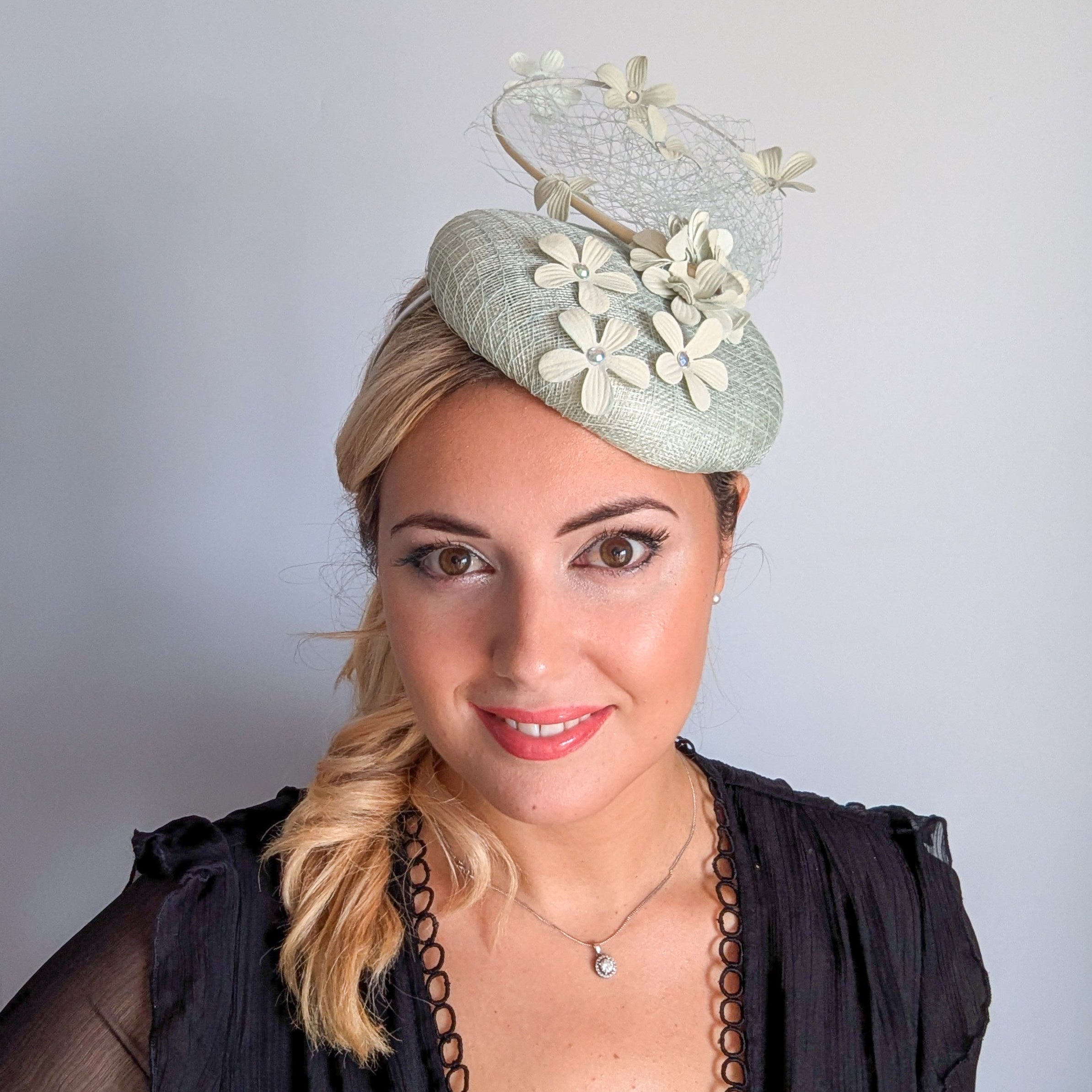 Light aquamarine blue flower fascinator hat