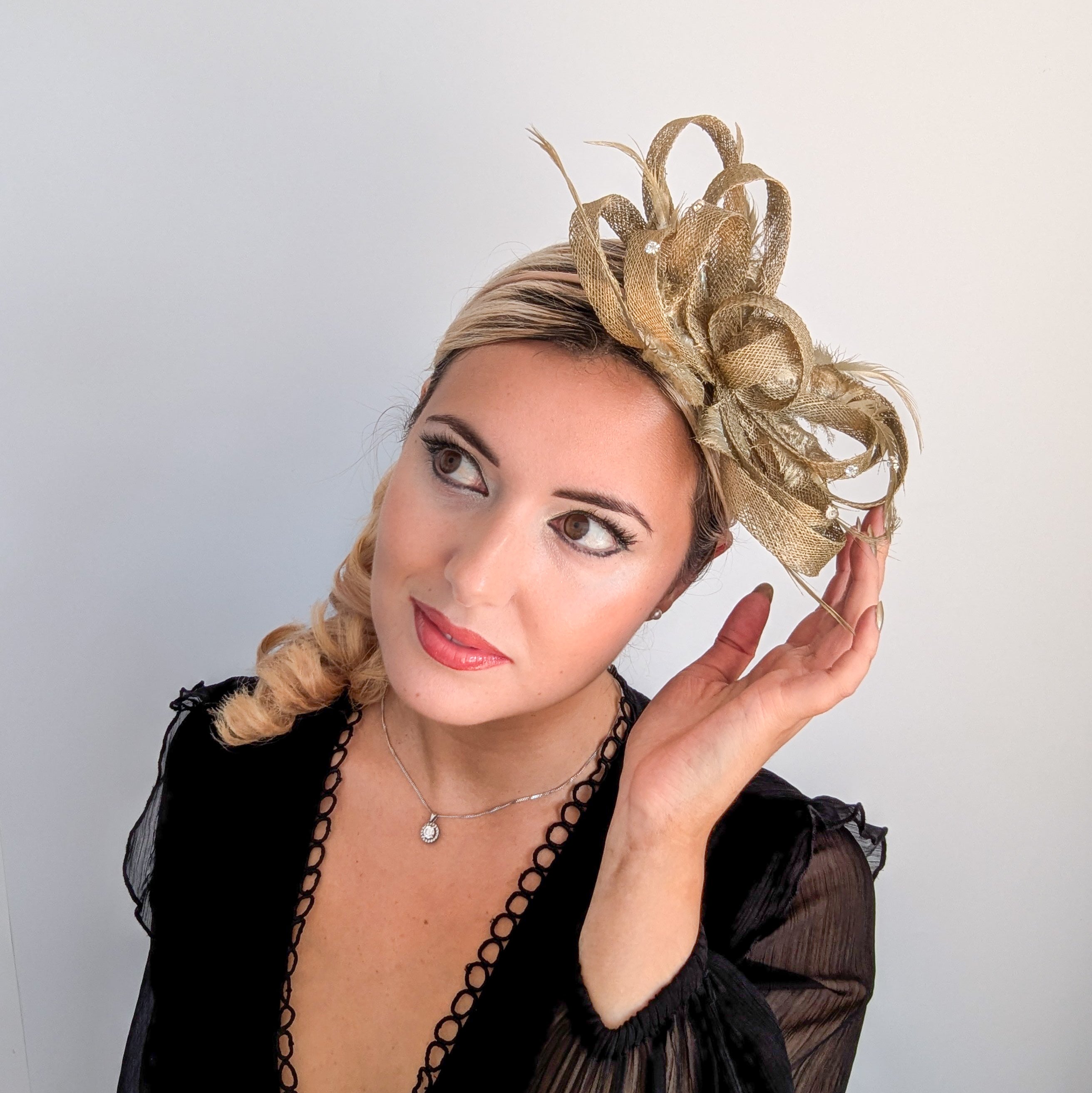 Gold shimmer crystal feather fascinator hat