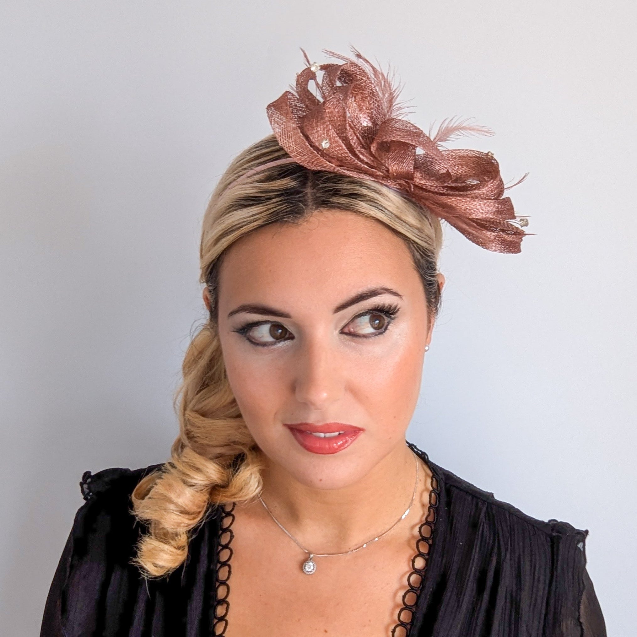 Rose gold shimmer crystal feather fascinator hat