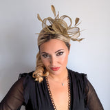 Gold shimmer feather fascinator hat House of Hats