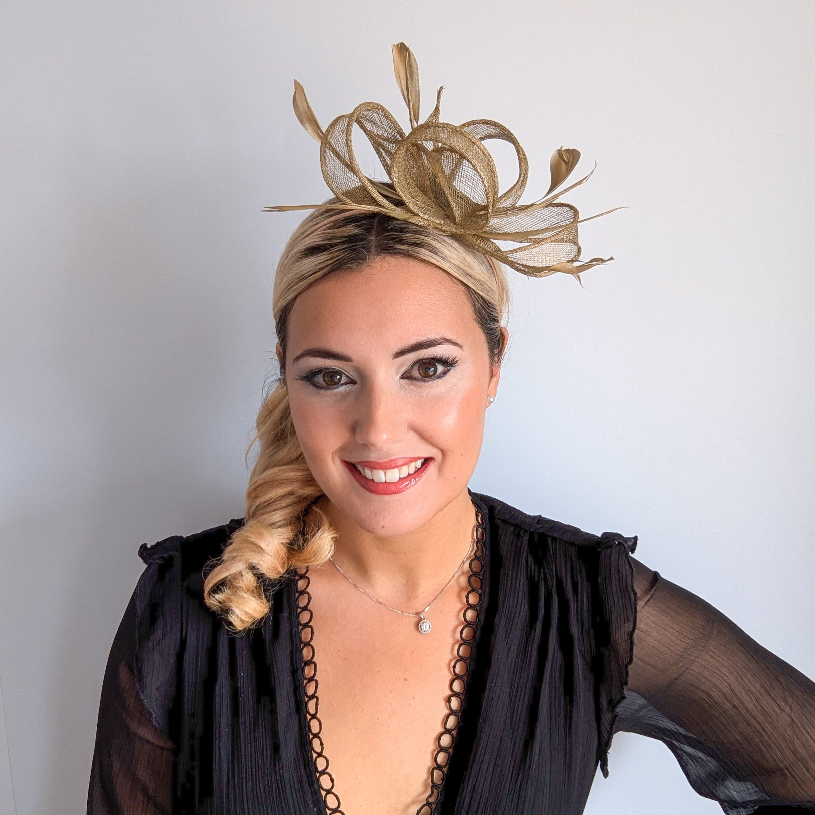 Gold shimmer feather fascinator hat House of Hats
