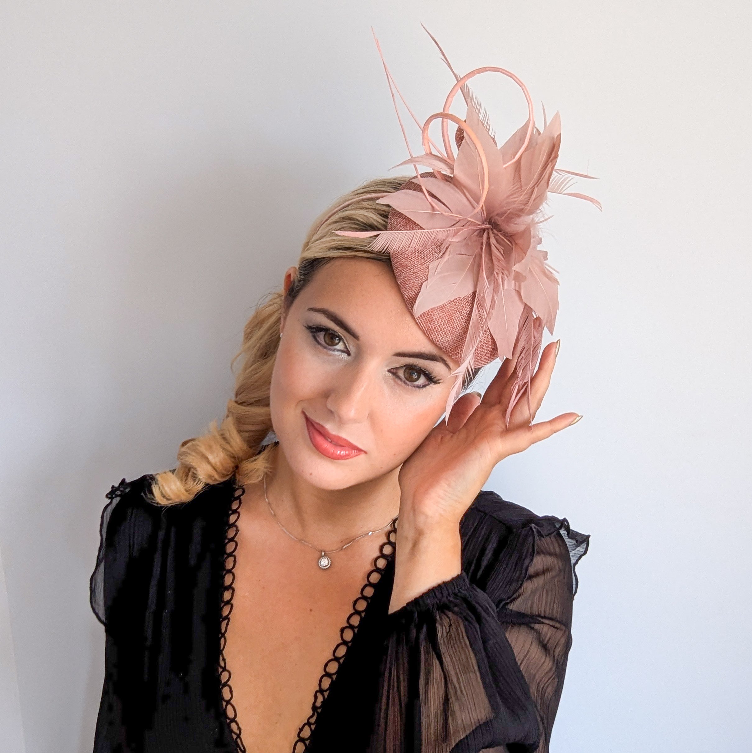 Blush pink feather fascinator hat