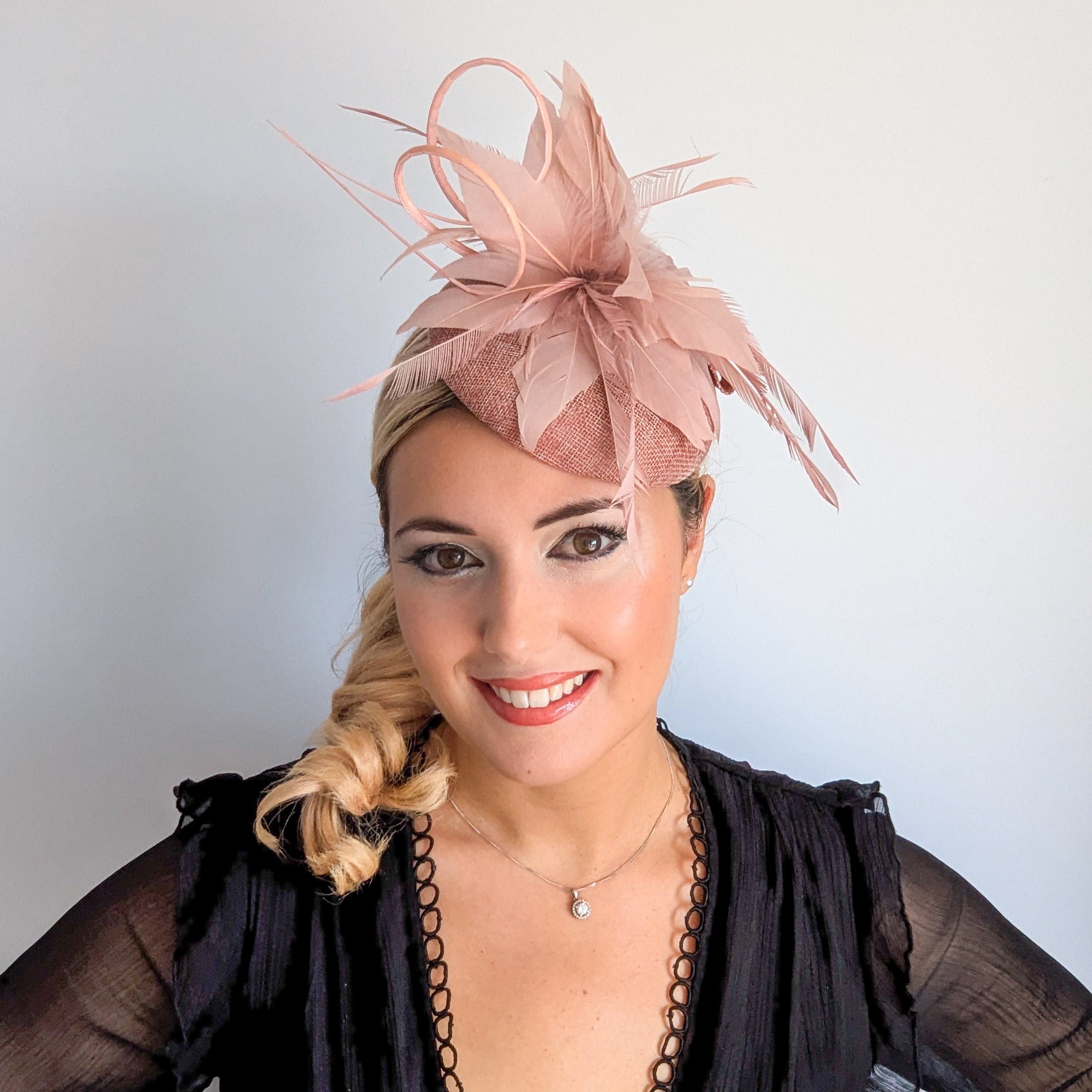 Blush pink feather fascinator hat
