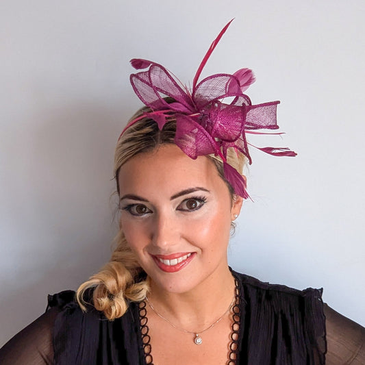 Magenta pink feather fascinator hat
