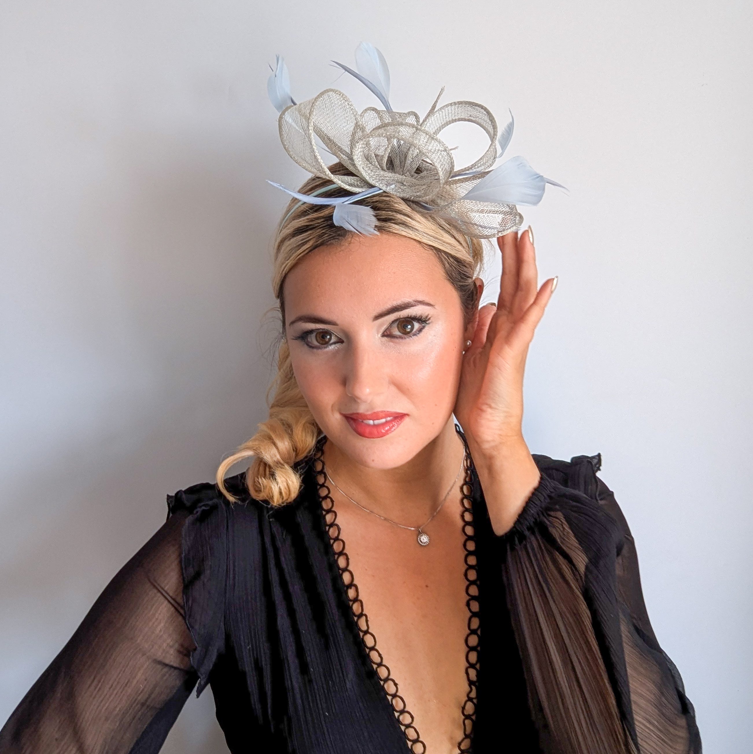 Aquamarine blue feather fascinator hat