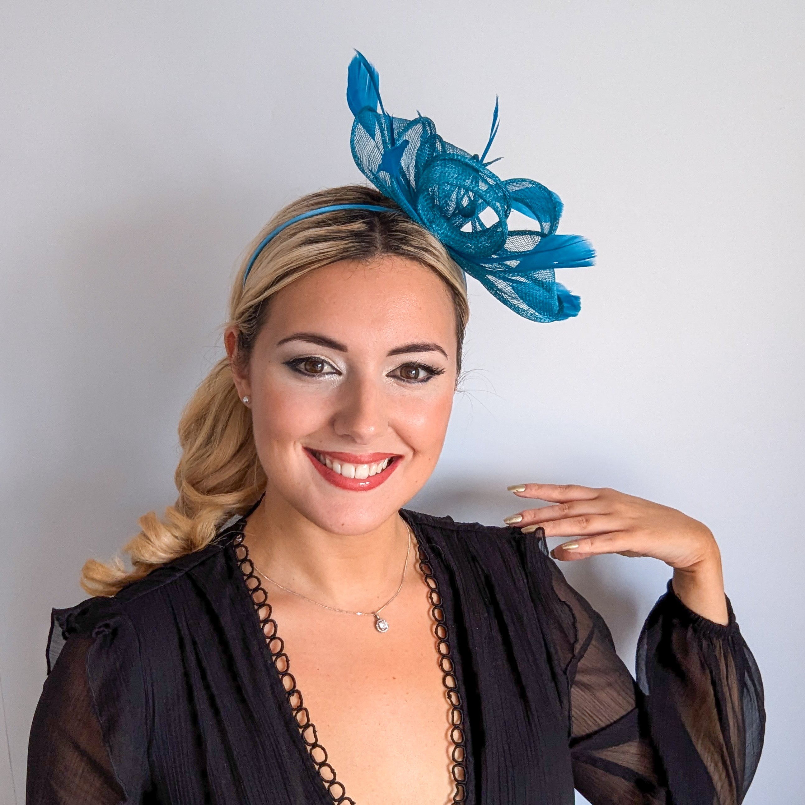 Dark acqua blue feather fascinator hat