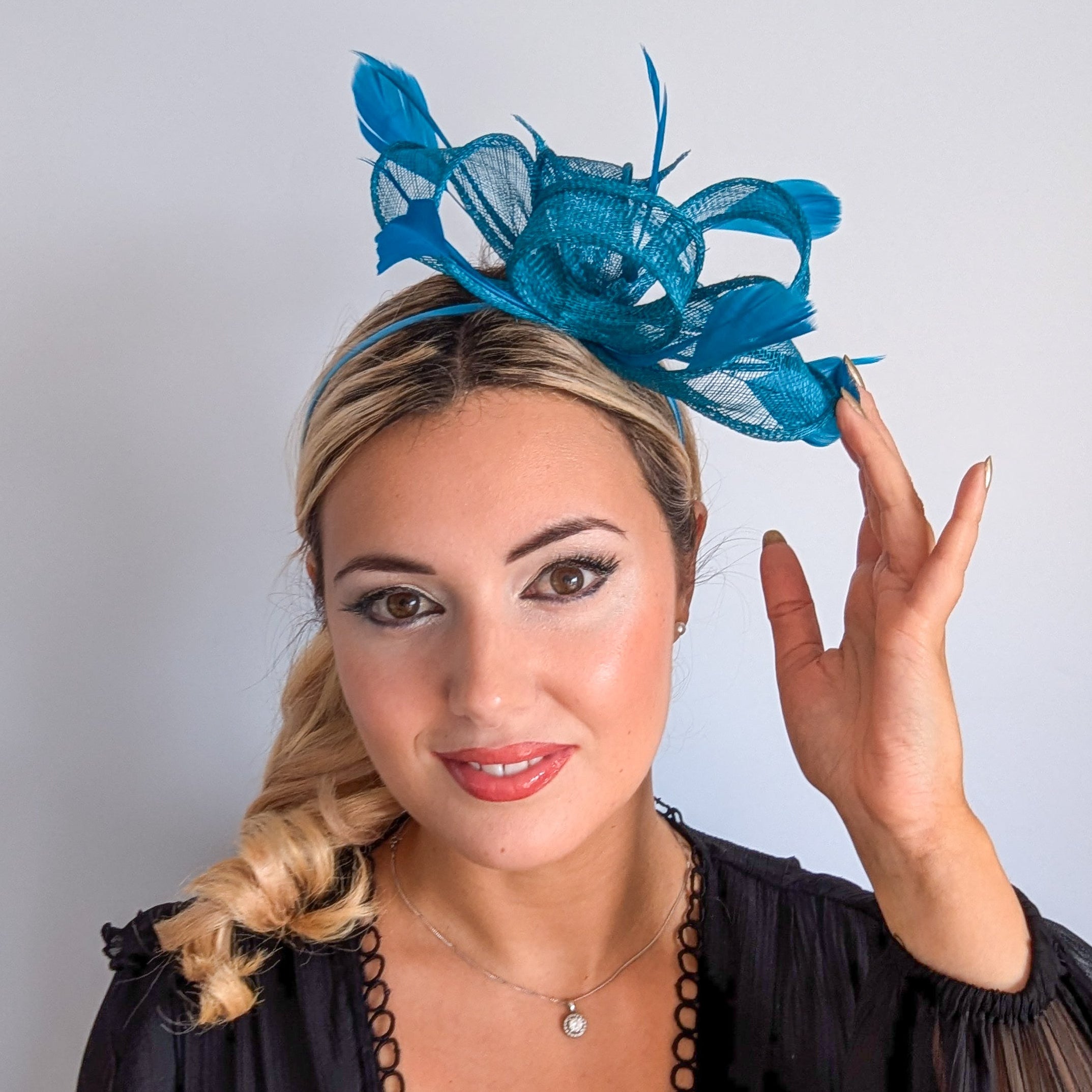 Dark acqua blue feather fascinator hat