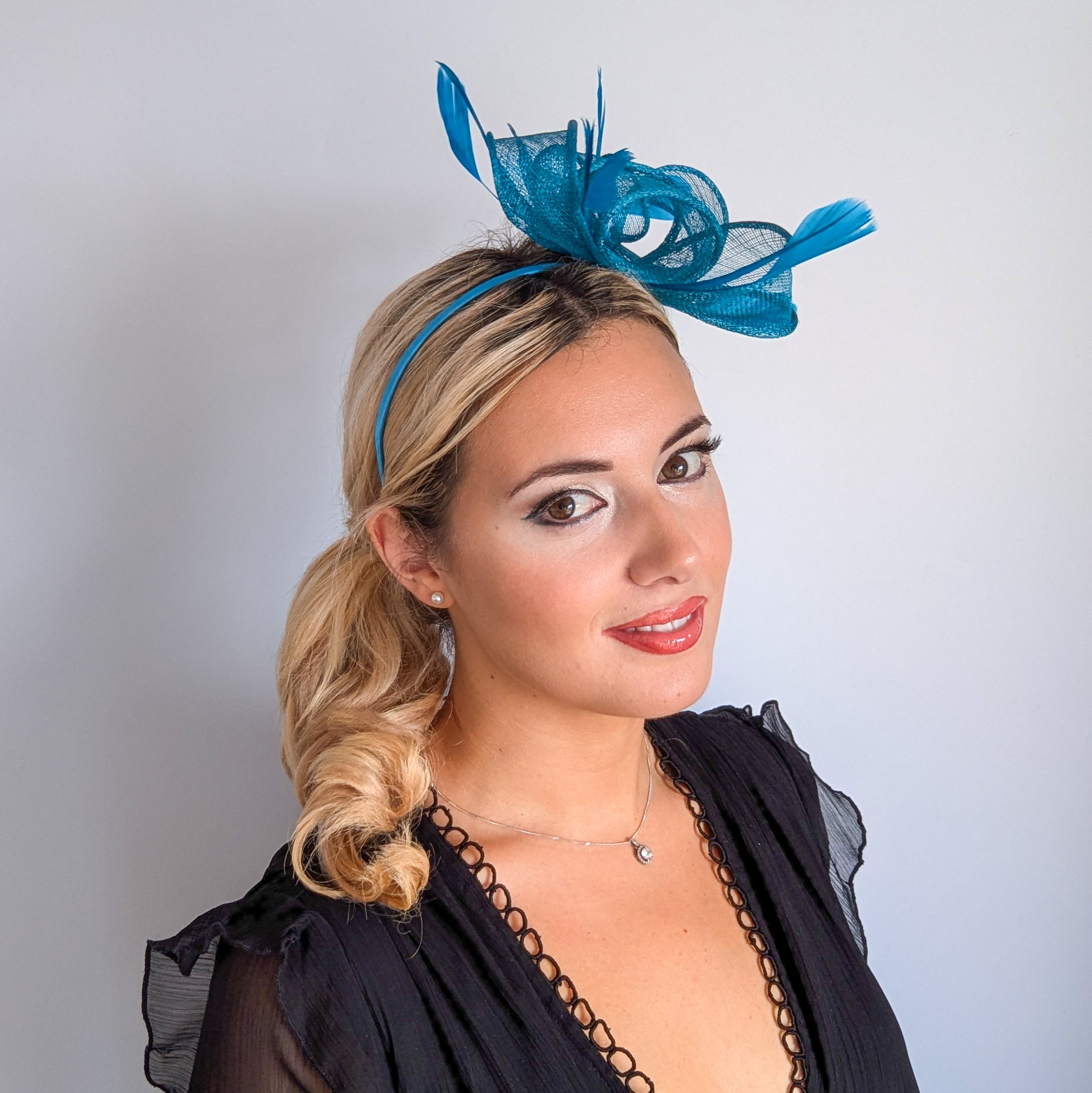 Dark acqua blue feather fascinator hat