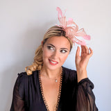 Light peach pink feather fascinator hat