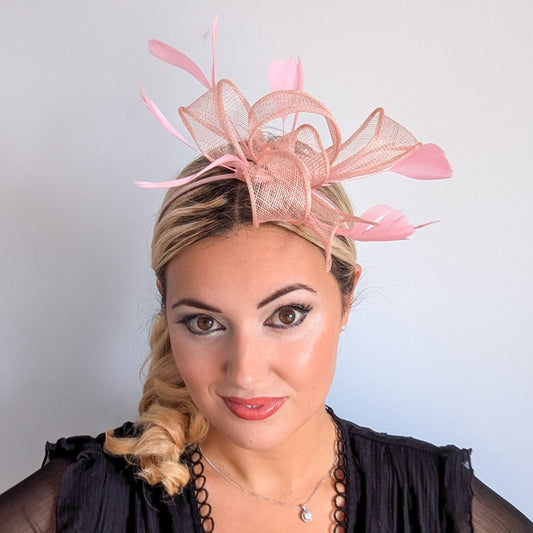 Light peach pink feather fascinator hat