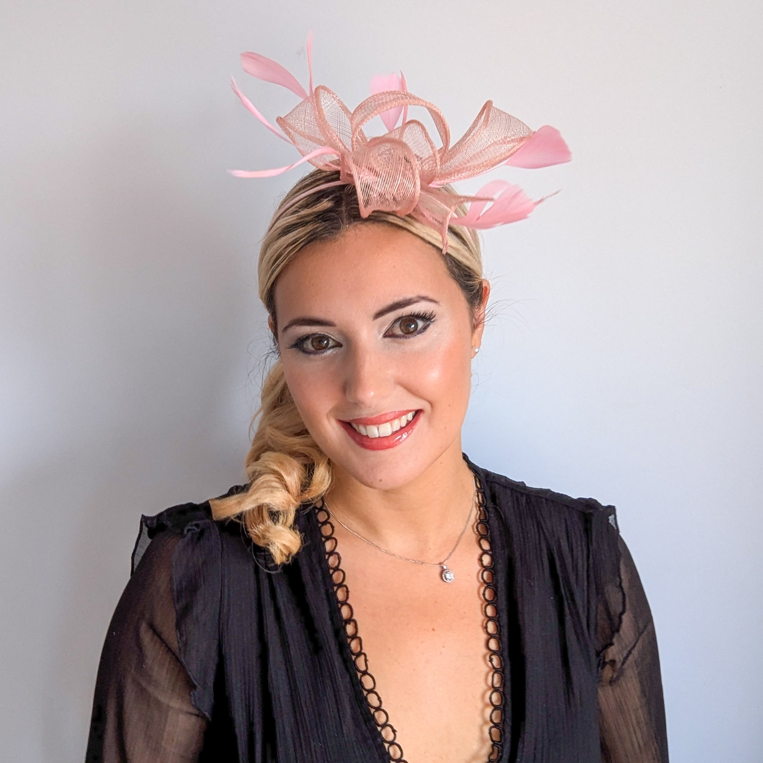 Light peach pink feather fascinator hat