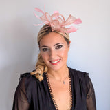 Light peach pink feather fascinator hat