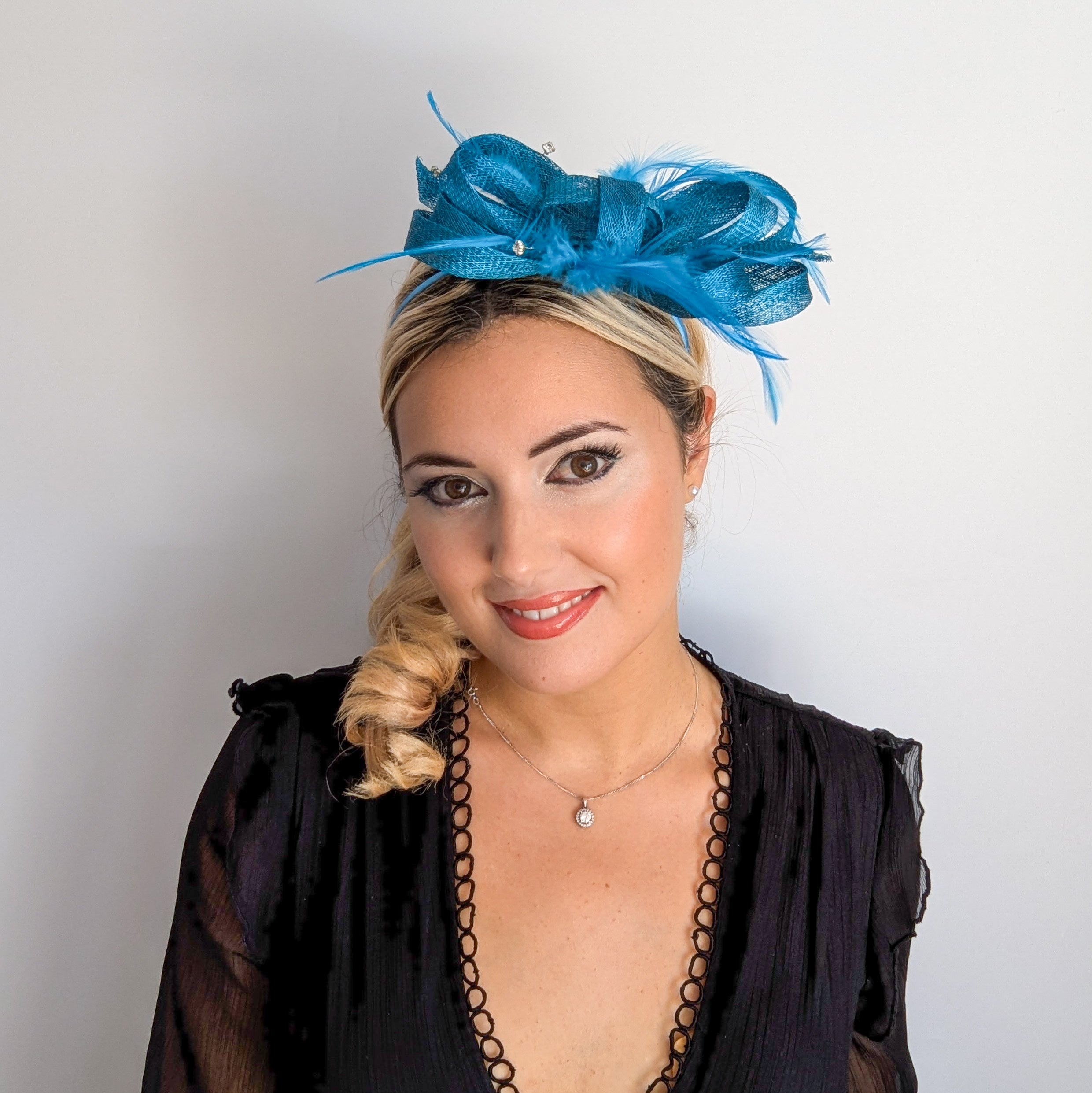 Dark aqua blue crystal feather fascinator hat