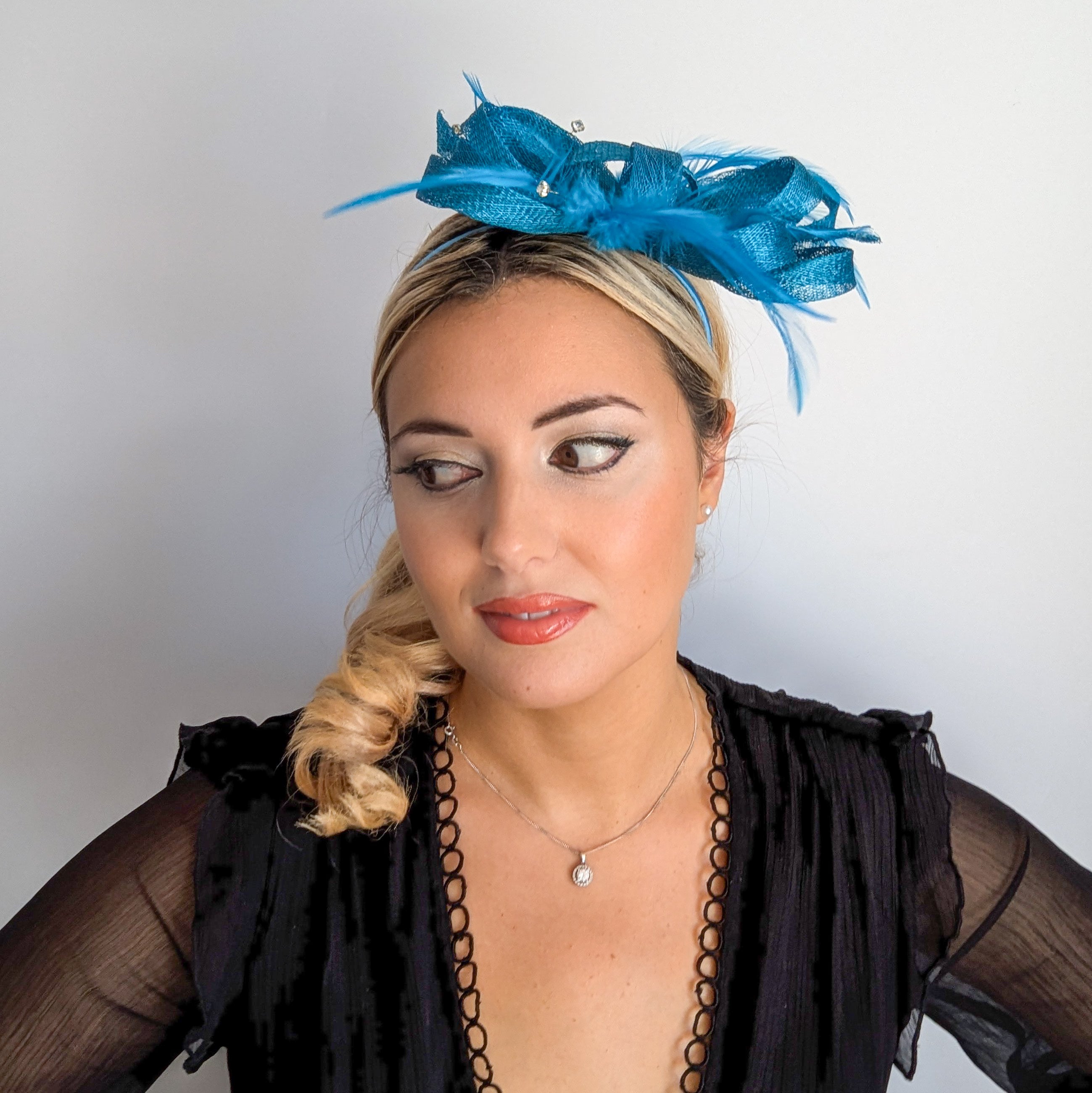 Dark aqua blue crystal feather fascinator hat