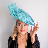Light turquoise green blue large feather saucer disc fascinator hat
