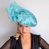 Light turquoise green blue large feather saucer disc fascinator hat
