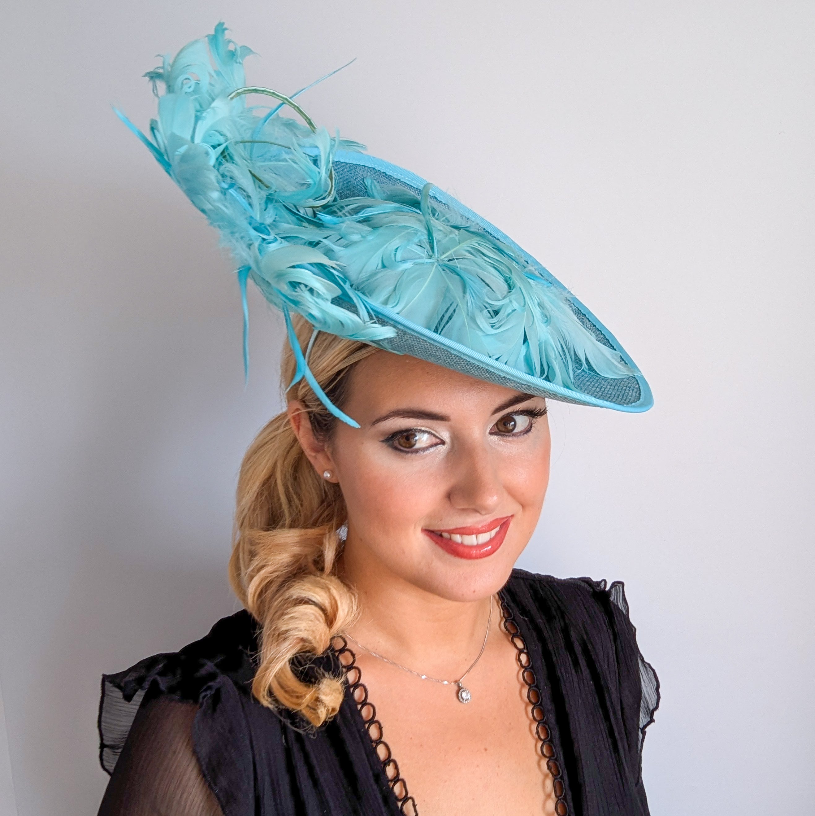 Light turquoise green blue large feather saucer disc fascinator hat