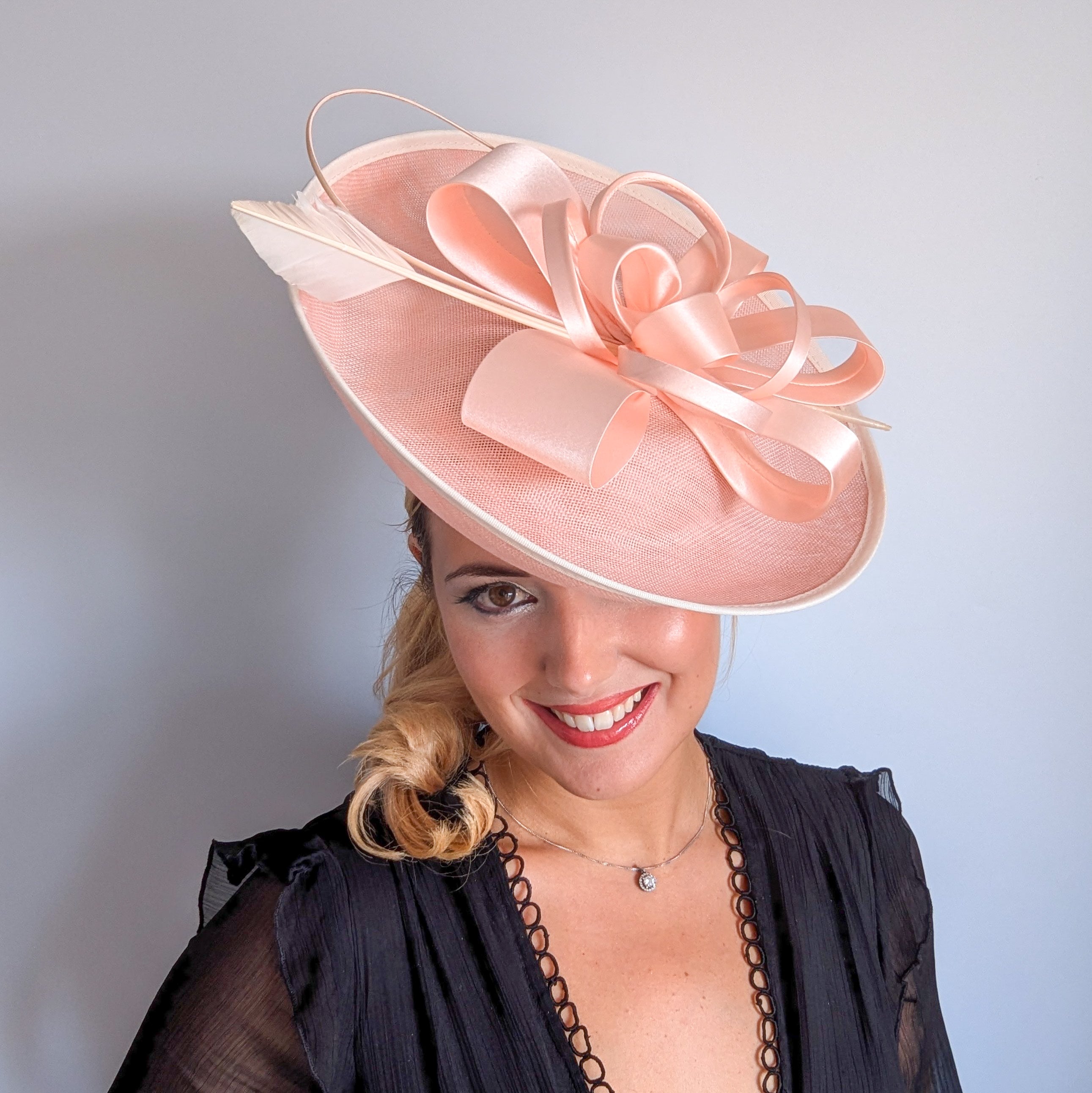 Light pink feather large saucer disc fascinator hat