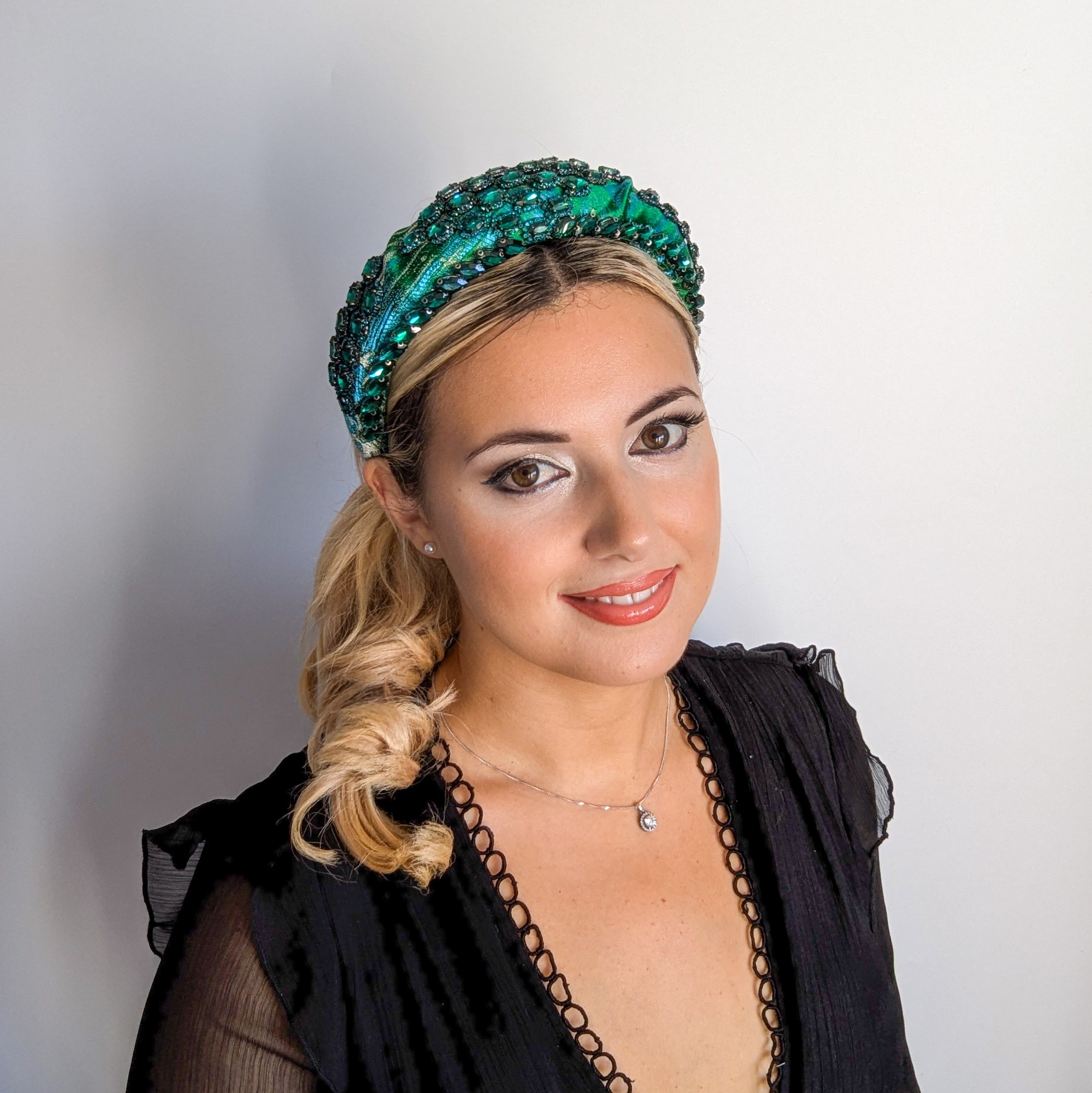 Emerald green crystal padded satin headband fascinator