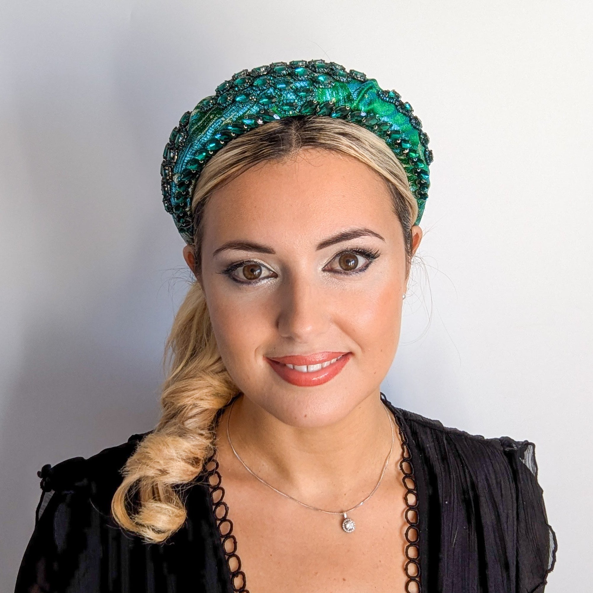 Emerald green crystal padded satin headband fascinator