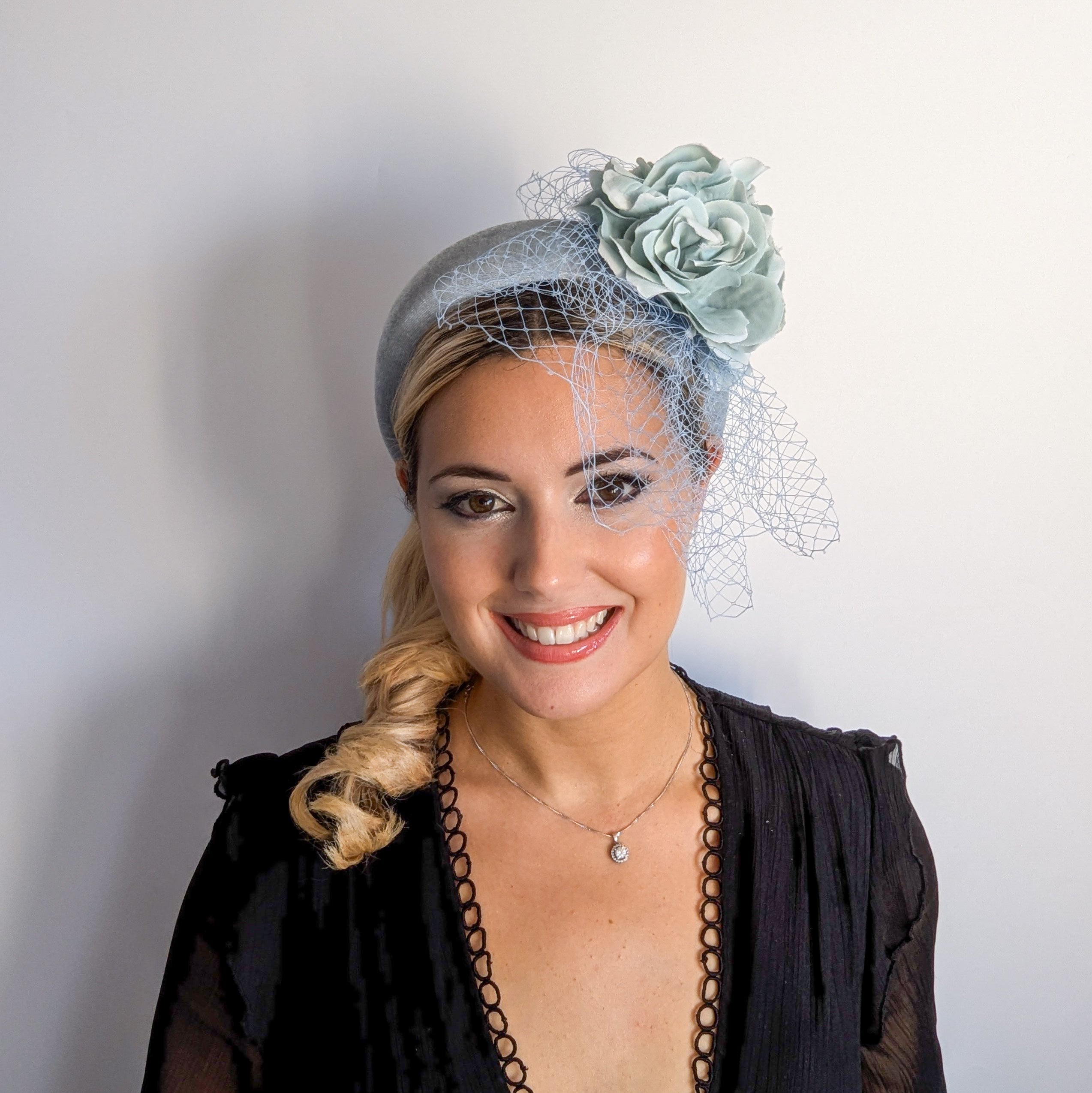 Aquamarine blue flower padded velvet headband fascinator