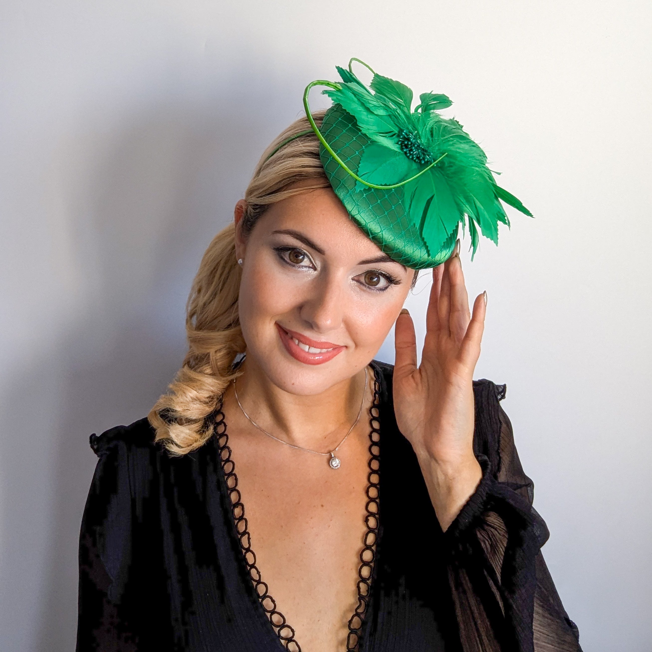 Shamrock green feather satin fascinator hat