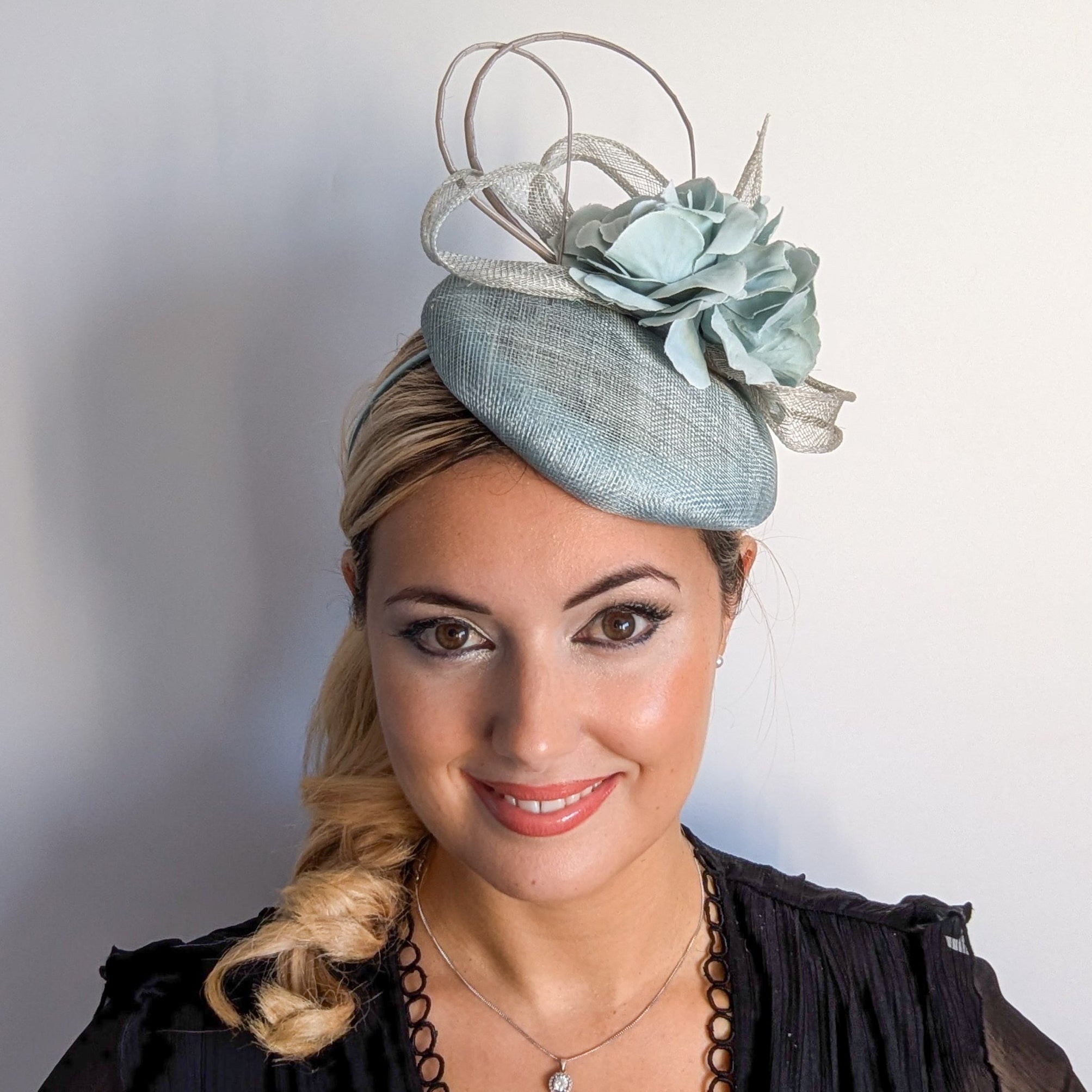 Aquamarine blue flower fascinator hat